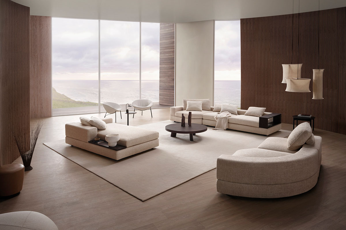 Curved sectional sofa in large living room. Modules are styled in open-plan layout to create flow and movement.