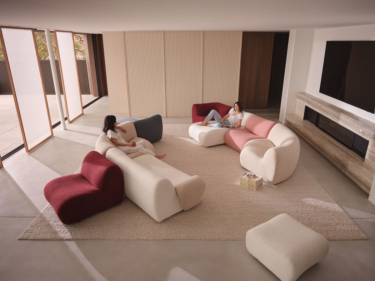 Modular sofa in a modern living space, styled in multi-coloured fabrics.