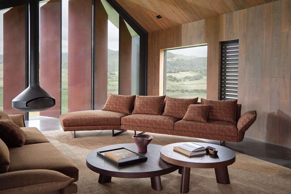 Open plan contemporary living and dining space styled with organic modern-inspired furniture and décor.