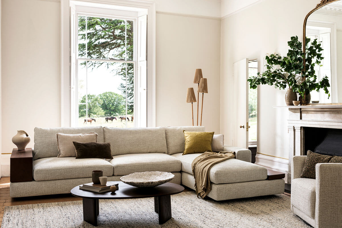 Fabric spotlight on Whiteley, a woven finish showcased in a contemporary light-filled living space on a modular sofa.