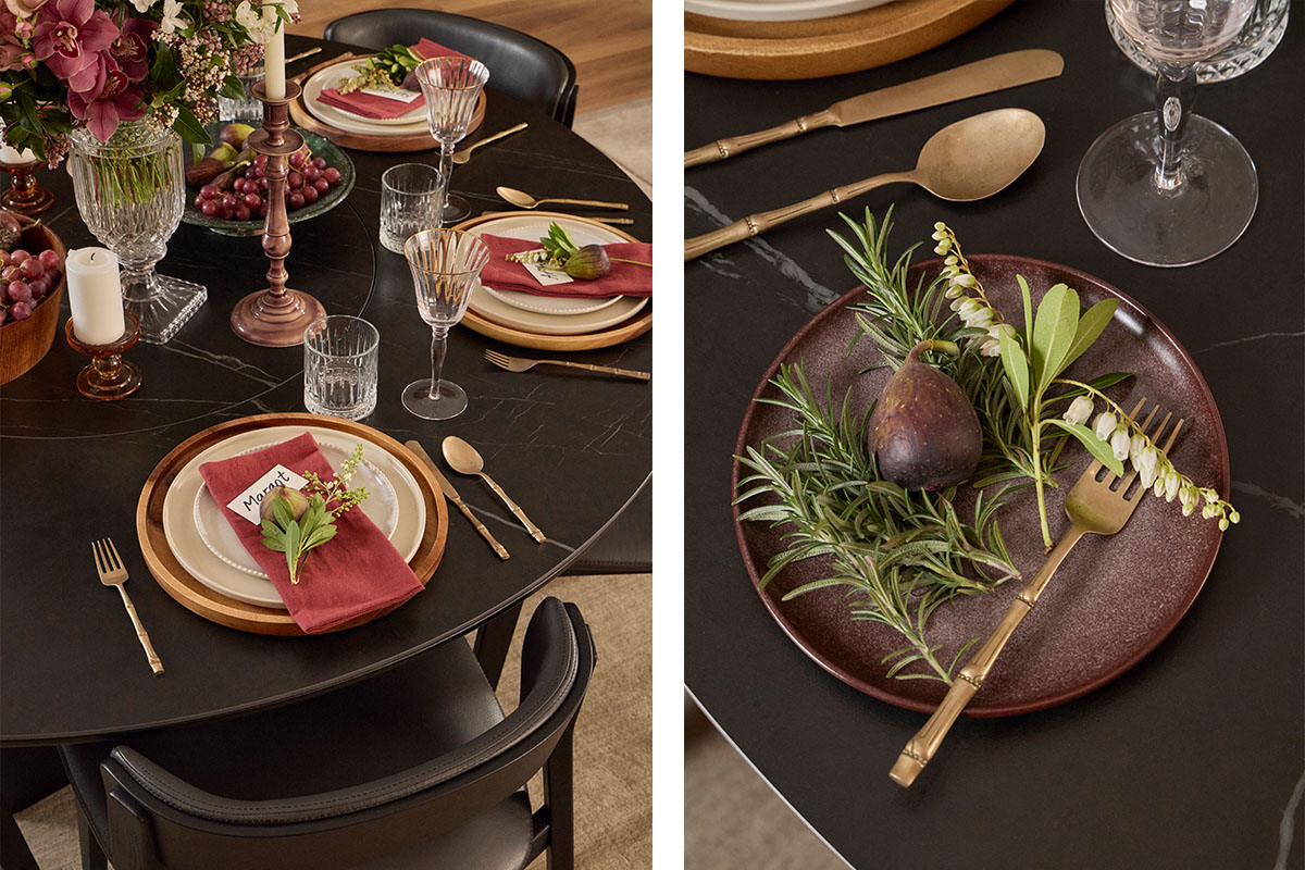 A black timber dining table paired with black leather dining chairs, styled traditionally in deep festive maroons and greens.