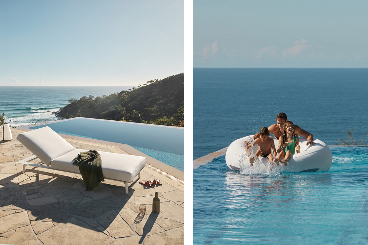 A poolside retreat overlooking the ocean, styled with an outdoor umbrella, sunlounge, with a family on a pool float in the water.